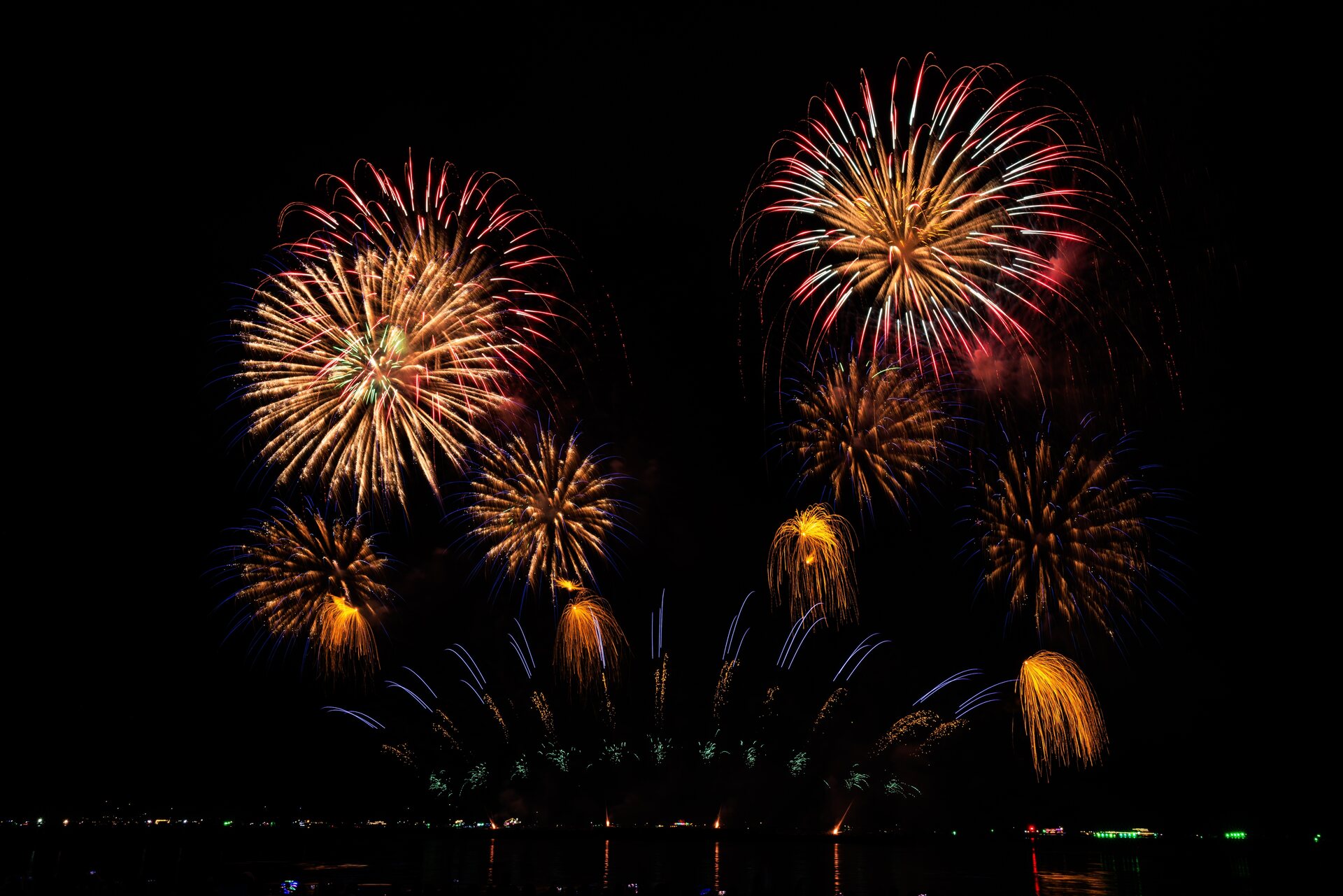 Golden fireworks showering light over a celebration